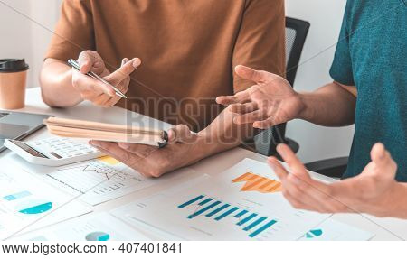 Meeting A Team Of Undercover Businessman, Executives And Accountants Meeting About The Company's Rev