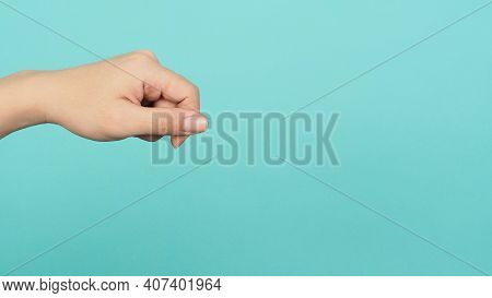 Empty Hand Holding Or Catch Nothing Guesture On Green And Blue Or Mint Background.