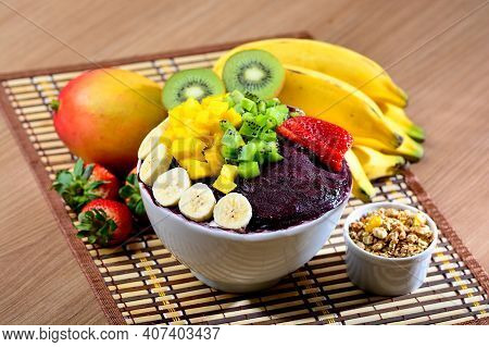 Acai Bowl With Fruits Salad Banana Mango Kiwi And Strawberry, Delicious Açaí Brazilian Cream Dessert