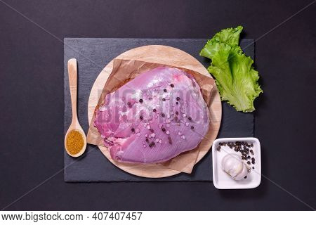 Raw Turkey Fillets On Cutting Board With Spices. Cooking Ingredients. Natural Healthy Food Concept.
