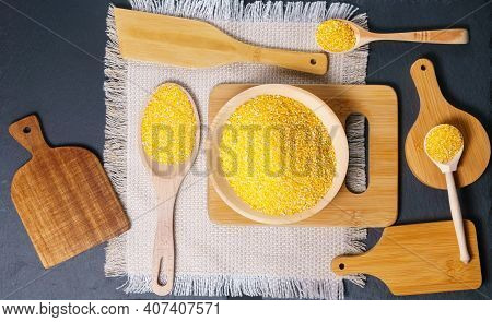 Organic Raw Corn Corn Grits On Black Background. Eco Food Concept. Gmo-free Concept