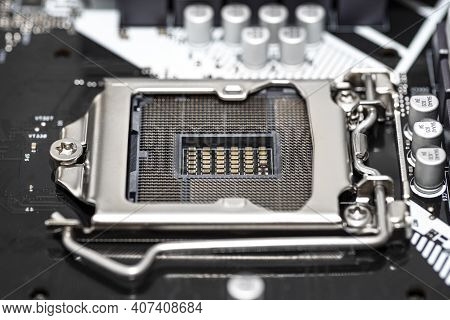 Macro Shot Of Empty Modern Lga 1200 Socket For Cpu On Black Desktop Motherboard.