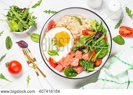 Savory Breakfast. Oatmeal Porrige With Salted Salmon, Egg And Fresh Salad. Healthy Food, Balanced Nu