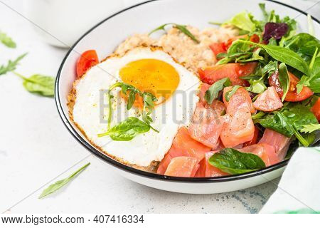 Savory Breakfast. Oatmeal Porrige With Salted Salmon, Egg And Fresh Salad. Healthy Food, Balanced Nu