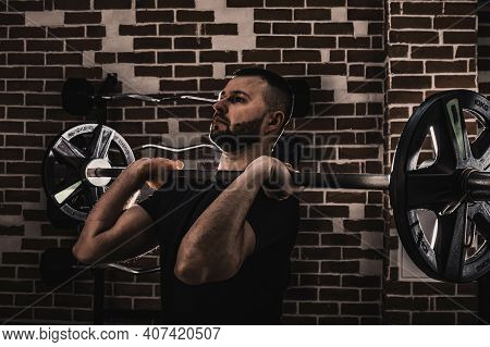 Fitness Man Doing Exercises In The Gym. Fitness And Healthy Lifstyle Concept