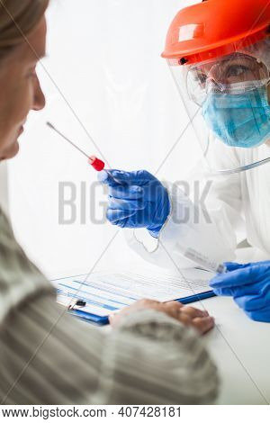 Covid-19 Rt-pcr Test Procedure,medical Worker In Ppe Wearing Hazmat Suit,face Shield & Mask,swabbing