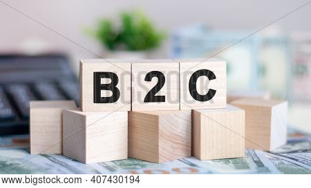 Concept Word B2c On Wooden Blocks On Beautiful Background From Green Flower. The Word B2c On Wood Cu