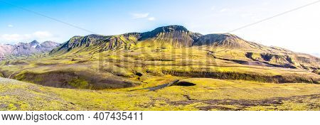 Green Hills And Black Rocky Ground Of Icelandic Highlands Along Laugavegur Hiking Trail, Iceland. Su