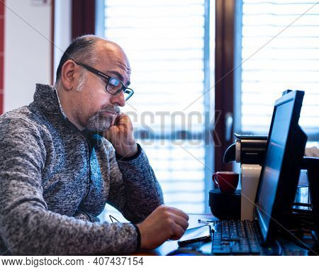 A Middle Aged Caucasian Man Working From Home, Is Pissed Off And Feels Isolated. Concept Of Stressfu