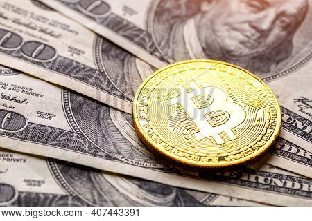 Golden Bitcoin Lies On The Banknotes.new Virtual Money. Crypto Currency Top View. Real Coins Of Bitc