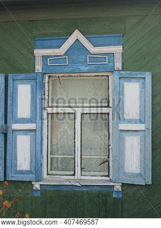 Window With Carved Wooden Shutters In A Russian House