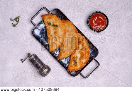 Fried Burekas With Filling On A Light Stone Background. Top View. Selective Focus.