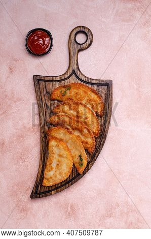 Fried Burekas With Filling On A Light Stone Background. Top View. Selective Focus.