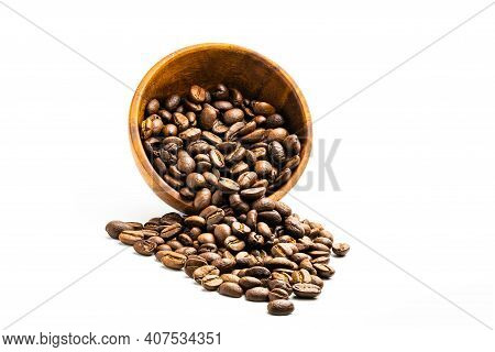 Pile Of Coffee Beans In Wooden Bowl On White Background With Clipping Path.