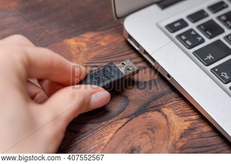 Image Of A Usb Cable Plugged Into A Laptop Port. The Concept Of Modern Ultra-fast Ways Of Transmitti