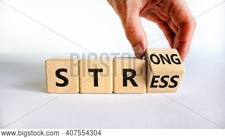 Strong Stress Symbol. Businessman Turns Wooden Cubes With Words 'strong Stress'. Beautiful Grey Back