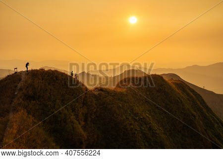 Traveler Man Hiking Enjoying In The Mountains With Backpack At Khao Chang Puak Mountain Thailand