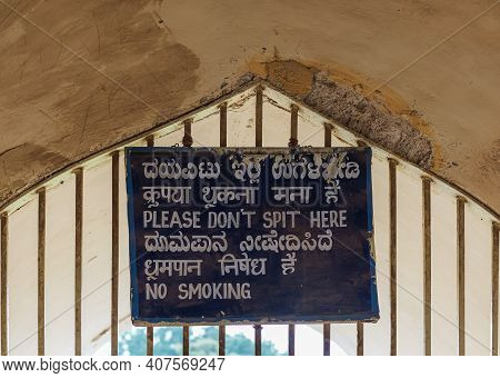 Vijayapura, Karnataka, India - November 8, 2013: Gol Gambaz Mausoleum. White On Blue Sign Forbitting