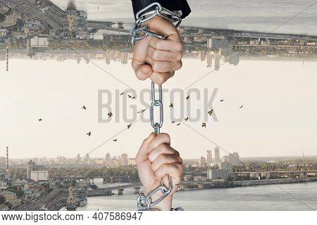 The Hands Of Businessmen Chained On Opposite Mirrored Sides Of The City.