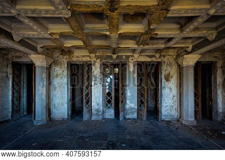 Old Abandoned Hall. Broken Wooden Doors Inside Abandoned Building