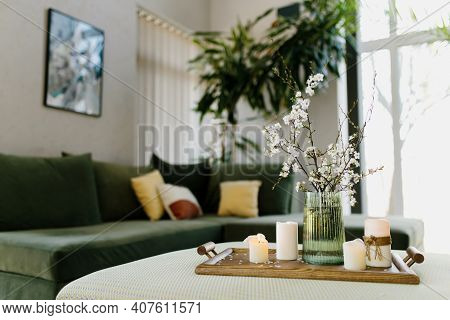 Home Interior. Relaxing Candles. Apple Tree Color Has Flown. Blurred Background