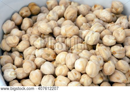 Close Up Of A Bowl Full Of Dried Garbanzo Beans, Also Called Chickpeas.