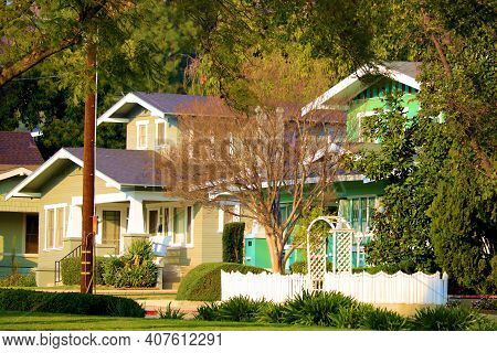 Historical Craftsman Style Homes Surrounded By Manicured Gardens Taken In A Residential Community