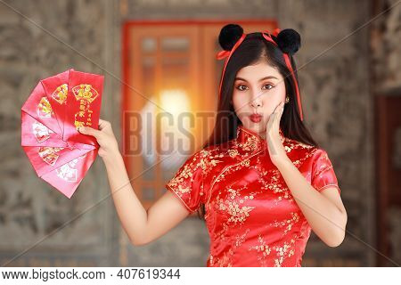 Beautiful Asian Woman In Red Chinese Dress Traditional Cheongsam Qipao With Gesture Of Showing Red E