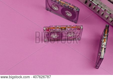 Boombox Stereo Radio Cassette Recorder And Random Cassettes On Pink Background. Vintage Cassette Dec