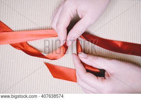 Female Hands Close-up, Holding A Gift In A Box With A Red Ribbon. Concept - Valentines Day, Womens Z