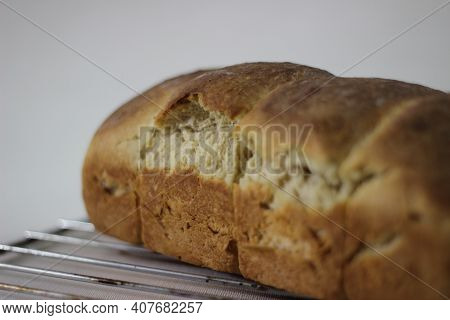 Home baked mini roll loaf bread with visible bands of rolls