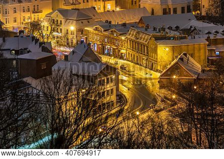 Gdansk, Oliwa, Poland - 16 January 2021 - View Of The Illuminated, Snow-covered Old Town In Oliwa. W