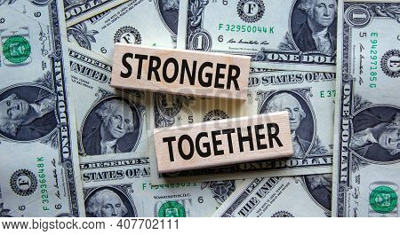 Stronger Together Symbol. Concept Words 'stronger Together' On Wooden Blocks On A Beautiful Backgrou