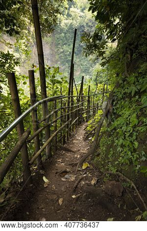 Trail With Bamboo Fences And Boards, Heading Towards The Waterfall At Tumpak Sewu Waterfall, In East
