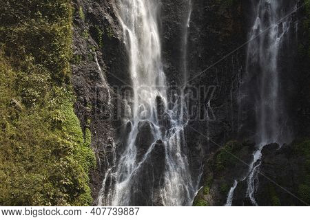 View Of The Fresh, Noisy And Intense Water In Tumpak Sewu Waterfall, In East Java, Indonesia.