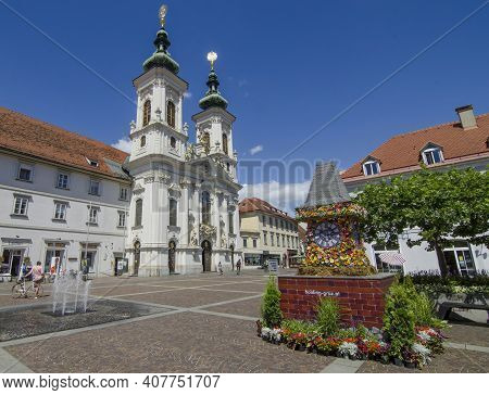 Graz,austria-july 07, 2020: The Famous Clock Tower, One Of The City Main Attractions, Made Of Flower