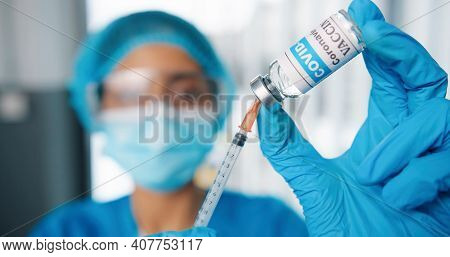 Close Up Shot Of Young Female Healthcare Specialist Hands Holding Ampoule With Coronavirus Vaccine P