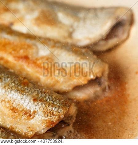 Fresh Smelt, Fried In Hot Oil In A Frying Pan For A Healthy Lunch Close Up. Smelt - Fish That Smells