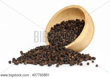 Black Pepper (black Peppercorns) In Wooden Bowl Isolated On White Background.