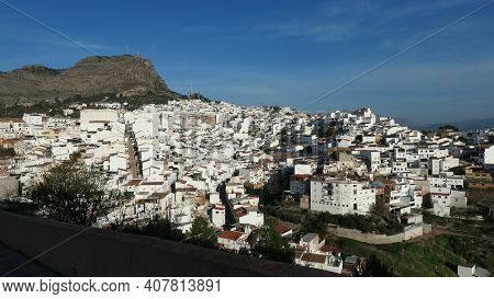 White Washed Houses Climbing Hillside In Sunny Andalusian Village Of Alora