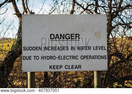 Sign Warning Of Danger Due To Sudden Increase In Water Due To Hydro Electric Operations On A River, 