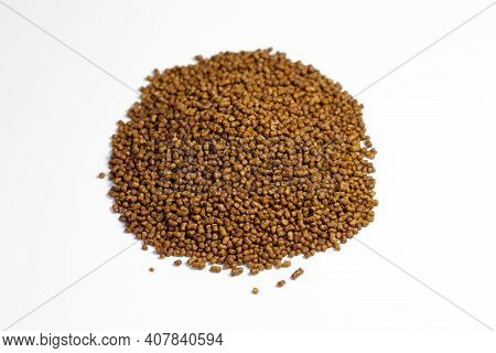 Buckwheat Tea On A White Background. Isolate. Buckwheat Tea Close-up Macro Photography. Scattered Bu