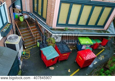 Chester; Uk: Jan 29, 2021: Wheelie Bins And Trade Size Trash Bins Are Seen Here, At The Rear Of Busi