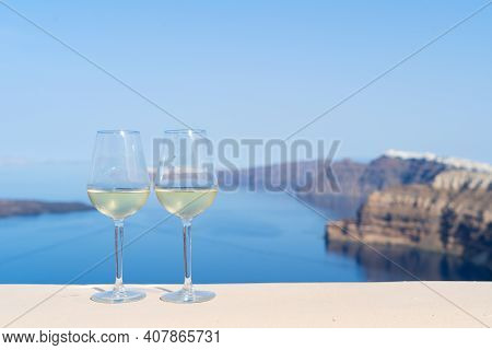 Two Glasses Of White Wine With Aegaen Sea In Background