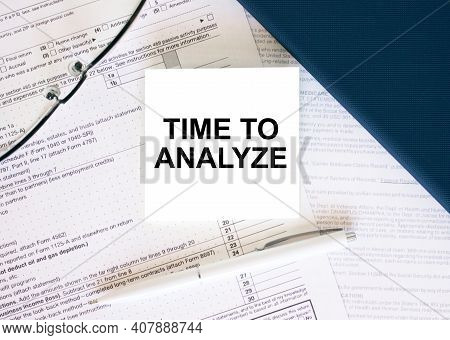 Tax Form With Business Card With Text Time To Analyze. Notepad, Eyeglasses And White Pen