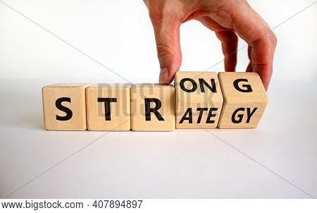 Strong Strategy Symbol. Businessman Turns Wooden Cubes With Words 'strong Strategy'. Beautiful White