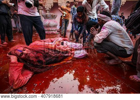 Barsana, Uttar Pradesh, India February 12 2021: Indian Ordinary Man Taking Ashirvaad Or Blessing Fro