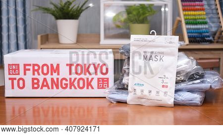 Bangkok, Thailand - Febuary 11, 2021: Uniqlo Washable Face Mask Package Near Cardboard Box Package D