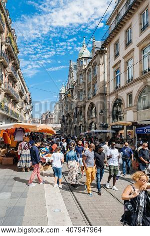 Strasbourg, France - July 29, 2017: Large Crowd Of People Walking On The Tramway Line Street Strasbo