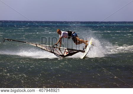 Prasonissi, Rhodes / Greece - June 23, 2014: Surfer At Cape Of Akra Prasonisi, Rhodes, Dodecanese Is
